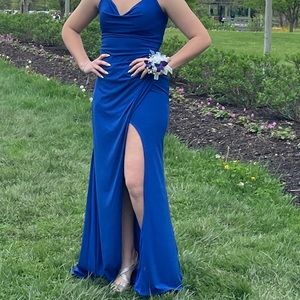 Royal blue size 12 with a corset back wore once and dry cleaned. Unaltered